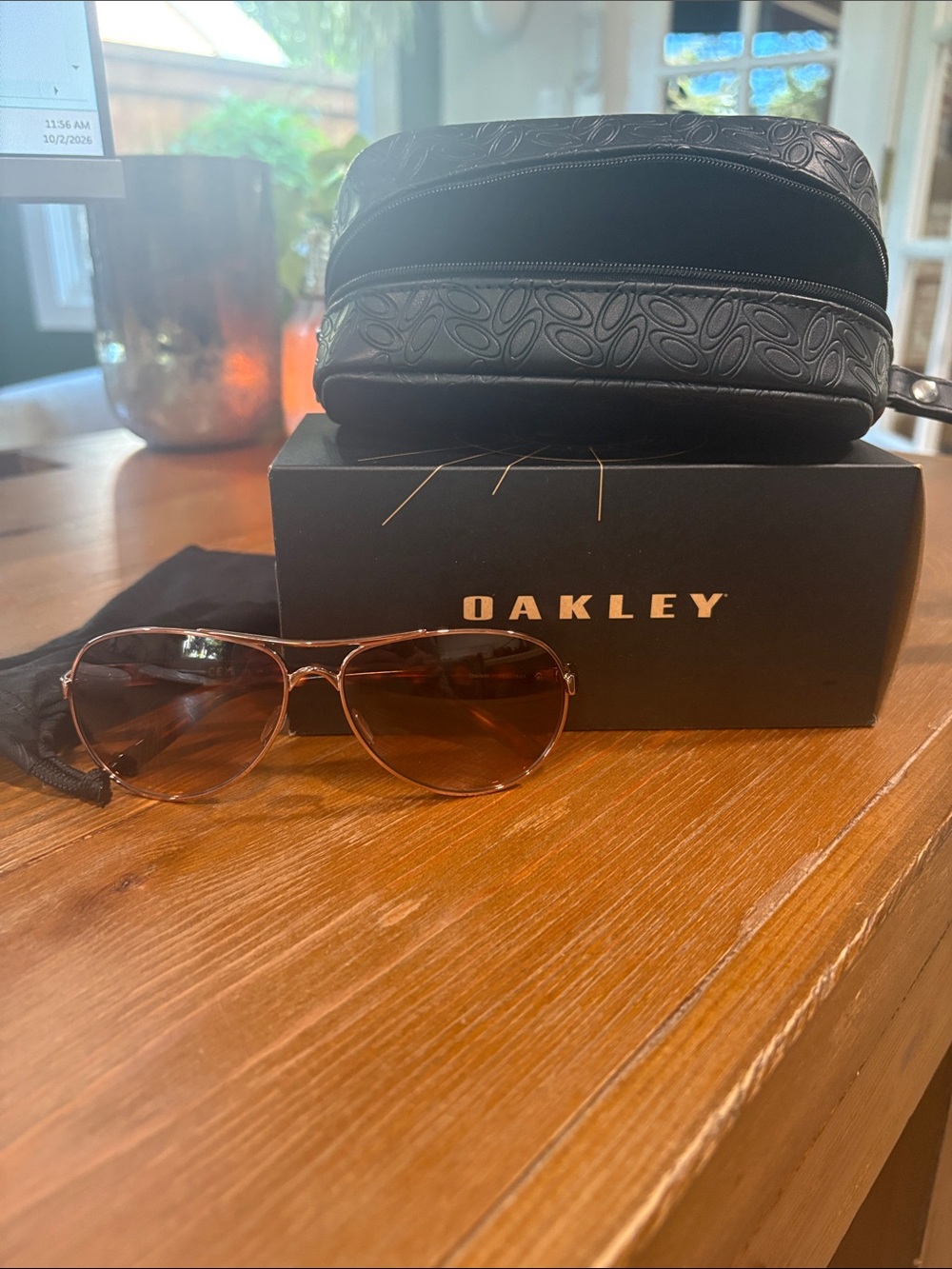 Oakley Women's Aviator Sunglasses in Brown Metal Frame with Brown Lenses